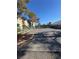 Outdoor parking lot with secure gate and views of the surrounding multi-Gathering residences at 520 Elm Dr # 202, Las Vegas, NV 89169