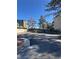 View of the parking lot, gated entry and mature trees at 520 Elm Dr # 202, Las Vegas, NV 89169