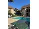 Inviting community pool with patio seating, near well-kept apartment homes with green awnings at 520 Elm Dr # 202, Las Vegas, NV 89169