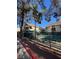 View of a community pool with seating and a fence, near apartment buildings at 520 Elm Dr # 202, Las Vegas, NV 89169