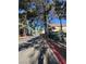 Street view of the well-maintained apartment complex with lush landscaping and sidewalks at 520 Elm Dr # 202, Las Vegas, NV 89169