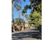 Community street view featuring mature trees and landscaping near the Thomas & Mack Center at 520 Elm Dr # 202, Las Vegas, NV 89169