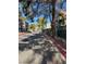 Well-maintained street with mature trees and landscaped areas leading to the apartment complex at 520 Elm Dr # 202, Las Vegas, NV 89169