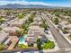 Overhead view of a neighborhood featuring solar-paneled roofs and community pool at 6301 Citrine Ave, Las Vegas, NV 89130