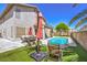 Beautiful backyard with pool and patio seating; perfect for outdoor entertaining at 6301 Citrine Ave, Las Vegas, NV 89130