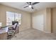 Bedroom featuring a ceiling fan, neutral tones, and a desk, creating a comfortable space at 6301 Citrine Ave, Las Vegas, NV 89130