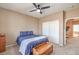 Comfortable bedroom with neutral tones, ceiling fan and closet at 6301 Citrine Ave, Las Vegas, NV 89130