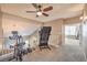Spacious bonus room with neutral tones, a ceiling fan, and space for gym equipment at 6301 Citrine Ave, Las Vegas, NV 89130