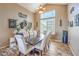 Elegant dining room with a large table, modern lighting, and stylish decor at 6301 Citrine Ave, Las Vegas, NV 89130