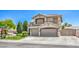 Stunning two-story home featuring a three-car garage, desert landscaping, and neutral color palette at 6301 Citrine Ave, Las Vegas, NV 89130