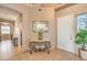 Welcoming foyer featuring decorative table, tile flooring, and entry to the home at 6301 Citrine Ave, Las Vegas, NV 89130