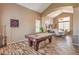 Spacious game room with a pool table, high ceilings, and wood-look tile flooring at 6301 Citrine Ave, Las Vegas, NV 89130