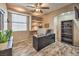 This home office provides a dedicated workspace with ample natural light and a custom bookshelf at 6301 Citrine Ave, Las Vegas, NV 89130