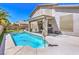 Sparkling pool in a well-maintained backyard with covered patio and lush landscaping at 6301 Citrine Ave, Las Vegas, NV 89130