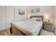 Bright bedroom featuring a Queen bed and laminate flooring with a wall closet at 6771 Shelter Ln, Las Vegas, NV 89103