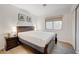 Cozy bedroom featuring a Queen bed and laminate flooring with a window and closet at 6771 Shelter Ln, Las Vegas, NV 89103