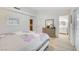 Bedroom featuring a king-size bed, dresser and a bathroom entrance at 6771 Shelter Ln, Las Vegas, NV 89103
