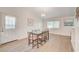 Dining room with table, six chairs, a light fixture and natural light coming through the window at 6771 Shelter Ln, Las Vegas, NV 89103