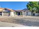 Single story house featuring low maintenance landscaping and a red tile roof at 6771 Shelter Ln, Las Vegas, NV 89103