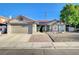 Charming single-story home with a well-maintained yard, desert landscaping, and a two-car garage at 6771 Shelter Ln, Las Vegas, NV 89103