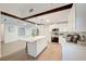 Bright, white kitchen with stainless steel appliances, a center island, and plenty of cabinet space at 6771 Shelter Ln, Las Vegas, NV 89103