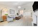 Comfortable living room featuring hardwood floors and ample natural light at 6771 Shelter Ln, Las Vegas, NV 89103