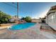 Backyard pool with waterfall feature and stone surround is perfect for entertaining and adds value to the property at 6771 Shelter Ln, Las Vegas, NV 89103