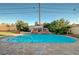 Backyard pool with landscaping and waterfall feature is perfect for entertaining and adds value to the property at 6771 Shelter Ln, Las Vegas, NV 89103