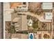 Bird's-eye view of a backyard featuring a pool, desert landscaping, and detached garage at 6908 Bienville St, Las Vegas, NV 89131