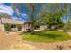 Backyard view with patio, pergola, mature trees, and well maintained lawn at 6908 Bienville St, Las Vegas, NV 89131