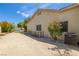 Side yard with gravel, dog run, and access to detached garage at 6908 Bienville St, Las Vegas, NV 89131