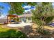 Backyard patio with pergola, mature trees and lush landscaping at 6908 Bienville St, Las Vegas, NV 89131