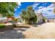 Backyard with pergola, patio, mature landscaping and access to detached garage at 6908 Bienville St, Las Vegas, NV 89131