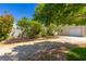 View of detached garage behind landscaped brick raised planting beds at 6908 Bienville St, Las Vegas, NV 89131