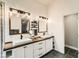 Elegant bathroom with dual sinks, wood countertops, shiplap walls, and a glass-enclosed shower at 6908 Bienville St, Las Vegas, NV 89131