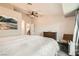Cozy bedroom featuring a dresser, chair, and large window at 6908 Bienville St, Las Vegas, NV 89131