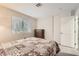 Bright bedroom with a comfortable bed, window, closet, and dresser for ample storage at 6908 Bienville St, Las Vegas, NV 89131