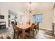Comfortable dining room with a large wooden table, seating for six, and stylish light fixture at 6908 Bienville St, Las Vegas, NV 89131