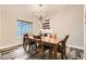 Bright dining room features wood floors, modern lighting, and a built-in bar at 6908 Bienville St, Las Vegas, NV 89131