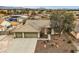 Charming single-story home featuring a three-car garage, desert landscaping, and a tile roof at 6908 Bienville St, Las Vegas, NV 89131