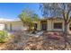 Beautiful single-story home with a well-maintained yard, mature trees, and a double-door entryway at 6908 Bienville St, Las Vegas, NV 89131