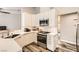 Clean kitchen design featuring stainless steel appliances, white cabinets, and mosaic backsplash at 6908 Bienville St, Las Vegas, NV 89131