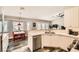 Well-lit kitchen with stainless steel appliances, white countertops, and cozy breakfast nook at 6908 Bienville St, Las Vegas, NV 89131