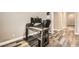 Home office with modern desk, computer setup, and stylish wood-look floors at 6908 Bienville St, Las Vegas, NV 89131