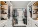 Organized walk-in closet with custom shelving and ample storage space for clothing and shoes at 6908 Bienville St, Las Vegas, NV 89131