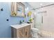 Updated bathroom featuring new vanity, fixtures, and glass-enclosed shower with tile surround at 7 Sturm St, Henderson, NV 89015
