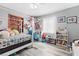 Bedroom featuring wood floors, a ceiling fan, and ample natural light at 7 Sturm St, Henderson, NV 89015