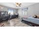 Bedroom with wood floors and window with privacy blinds at 7 Sturm St, Henderson, NV 89015