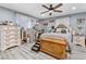 Spacious bedroom with wood floors, ceiling fan, and two dressers at 7 Sturm St, Henderson, NV 89015