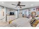 Bright and airy bedroom with white dresser, tv, and light grey walls at 7 Sturm St, Henderson, NV 89015
